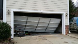 Broken residential overhead garage door