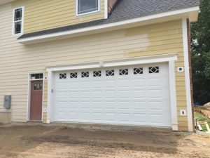 Garage installed on a new yellow home