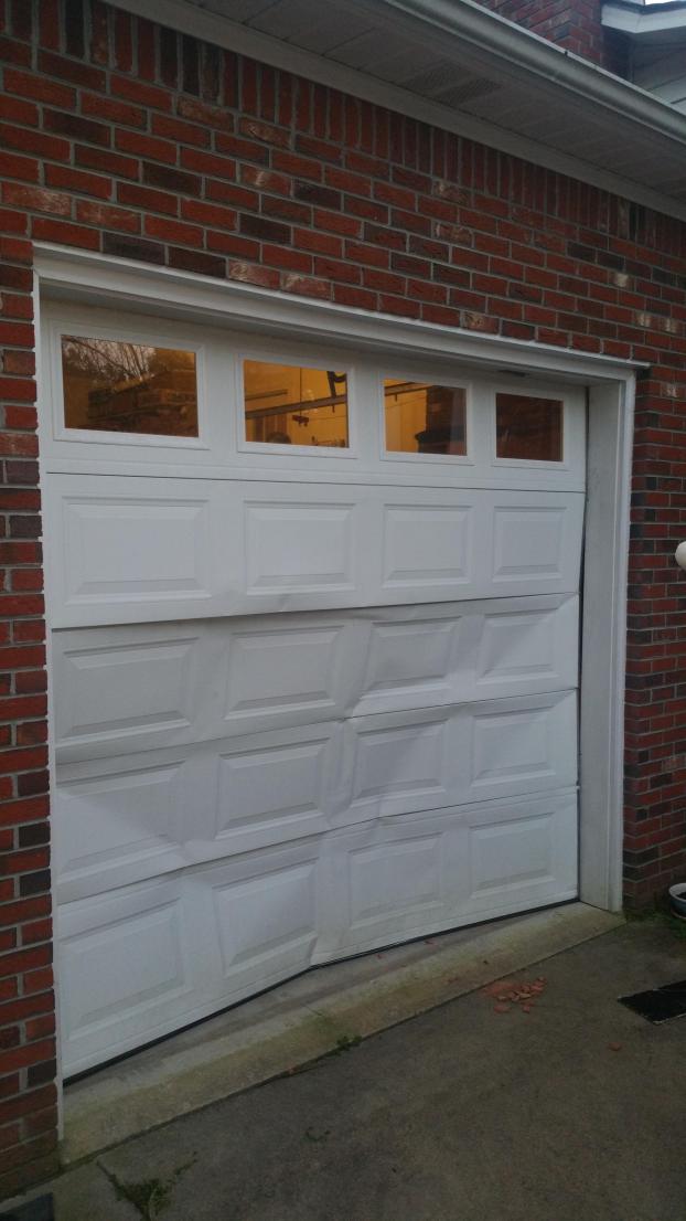 Broken in garage door