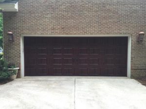 Wide brown custom garage door by All American Overhead