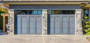 Dual blue garage doors with windows